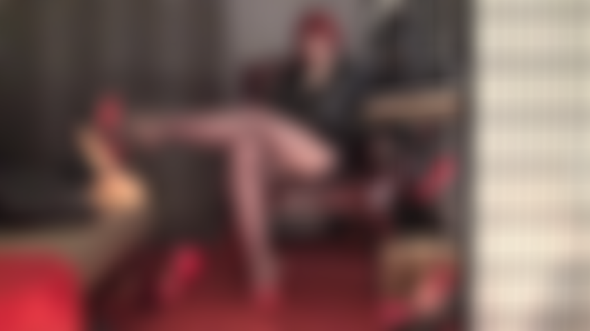 Bound and throbbing at Mistress' feet - Her legs and feet are your passion, her gentle touch your craving. Mistress has your head spinning in red high heel mules and coffee brown pantyhose.